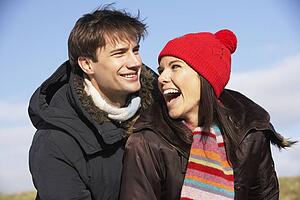 Couple Laughing In The Park Together