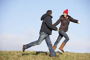Couple Running In The Park