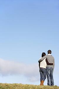 Couple Standing In The Park