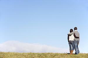 Couple Standing In The Park