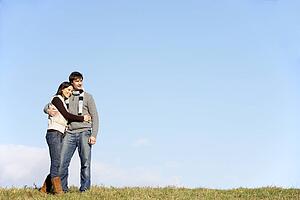Couple Standing In The Park