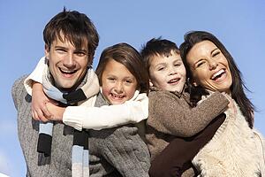 Parents Piggy Backing Their Children