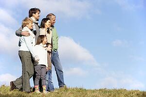 Family Standing In The Park