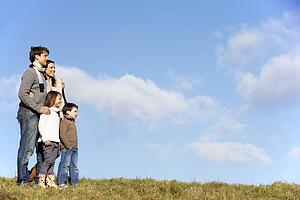 Family Standing In The Park
