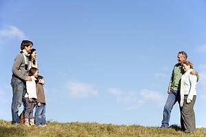 Family Standing In The Park