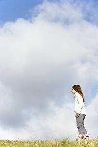 Young Girl Standing In The Park