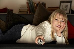 Young Girl Using Television Remote Control