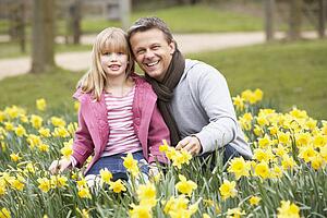Father And Daughter In Daffodils