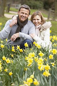 Couple Kneeling In Daffodils