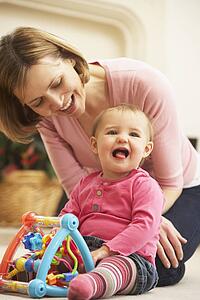 Mother And Daughter Playing
