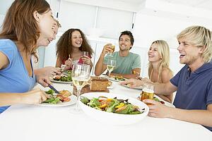 Friends Having Lunch Together At Home