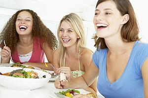 Friends Having Lunch Together At Home