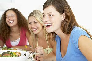 Friends Having Lunch Together At Home