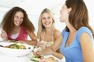 Friends Having Lunch Together At Home