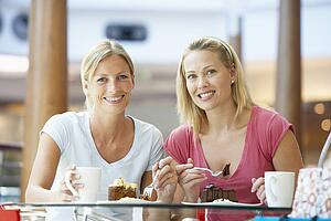 Female Friends Having Lunch Together At The Mall