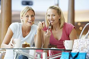 Female Friends Having Lunch Together At The Mall