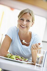 Woman Eating Lunch At A Cafe