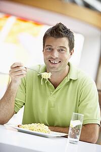 Man Eating Lunch At A Cafe