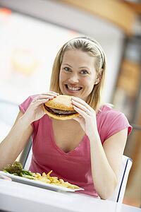 Woman Eating Lunch At A Cafe