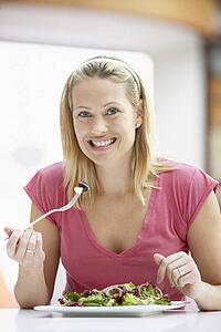 Woman Eating Lunch At A Cafe
