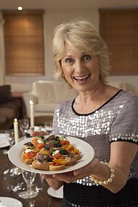 Woman With Hors D'oeuvres For A Dinner Party