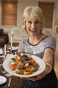 Woman With Hors D'oeuvres For A Dinner Party