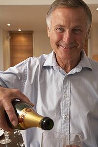 Man Pouring A Glass Of Champagne