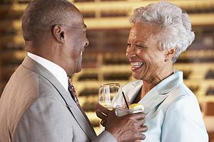 Couple Enjoying A Drink At A Bar Together