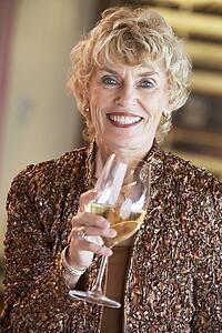 Woman Having A Glass Of Wine At A Bar