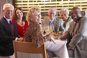 Friends Having Dinner Together At A Restaurant