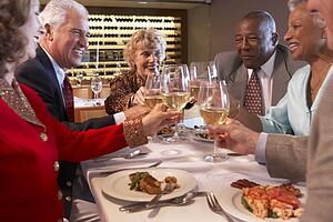 Friends Having Dinner Together At A Restaurant