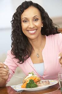 Woman Enjoying A Meal At Home