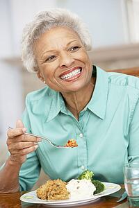Woman Enjoying A Meal At Home