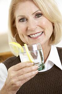 Woman Having A Drink At Home