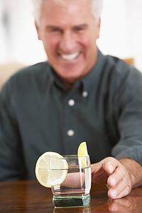 Man Having A Drink At Home