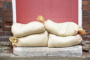 Sandbags Stacked In A Doorway In Preparation For Flooding