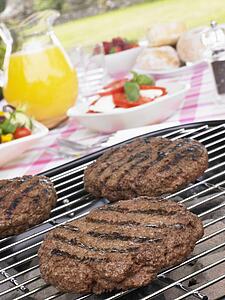 Burgers Cooking On Barbeque Grill