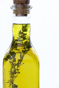 Bottle Of Olive Oil With Herbs