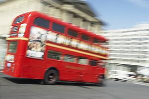 Double Decker Bus Driving Through The Streets Of London