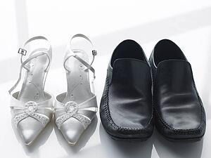 Bride And Groom's Shoes Side By Side