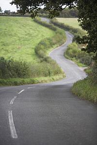 Road Winding Its Way Through The Countryside