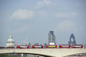 Double Decker Buses Lined Up On A Bridge With St Paul's Cathedral In The Background