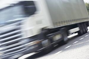 Truck Driving Along The Road
