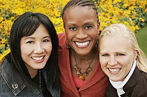 Multiethnic portrait of three women outdoors