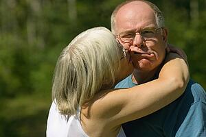 Woman kissing a man