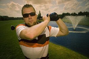 Portrait of young male golfer