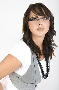 Woman wearing glasses and a vest
