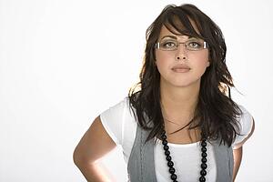 Woman wearing glasses and a vest
