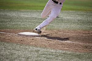 Baseball player running home