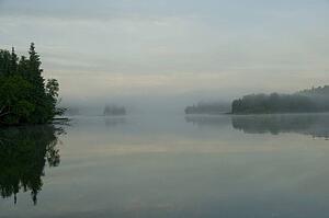 Lake of the Woods, Ontario, Canada; View across lake at sunrise